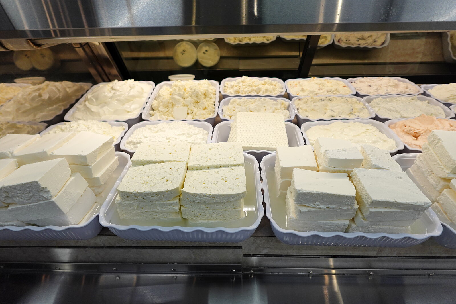 Trays of fresh soft cheeses and tvorog at the Bathurst Village Market dairy counter